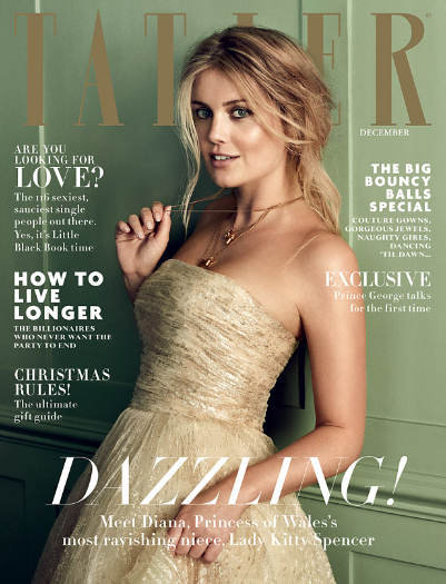 The cover of the magazine which features a woman in a brown dress.