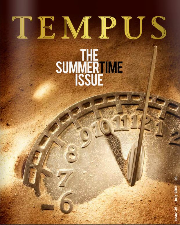 The photo of the old watch in the sand. The image is the cover of the magazine.