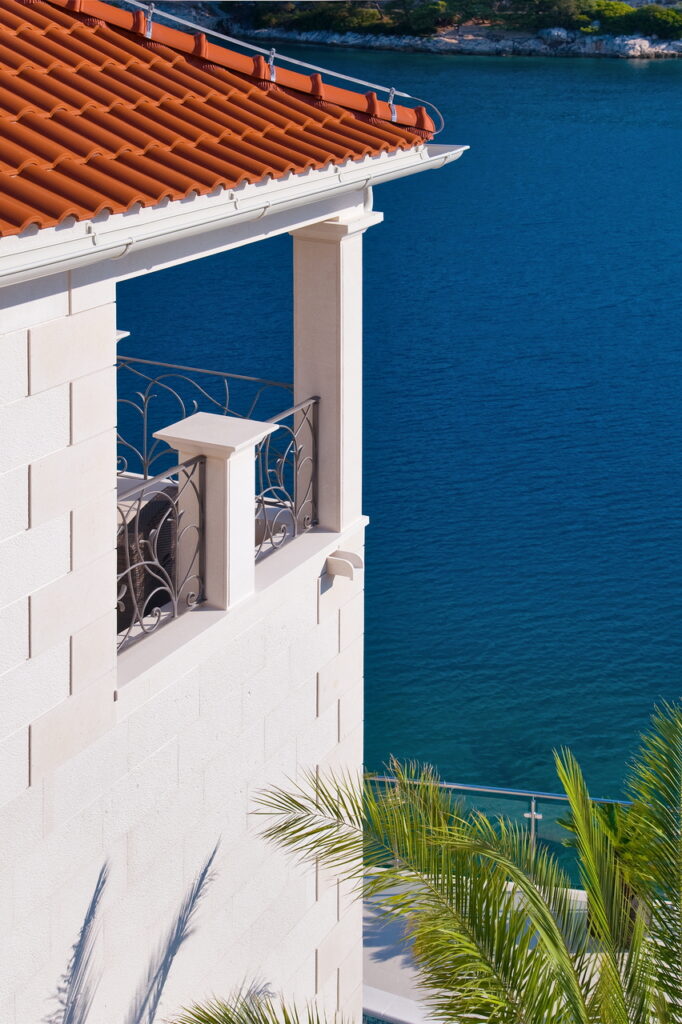 The hidden balcony on the stone villa with an orange roof with a spectacular view on the sea.